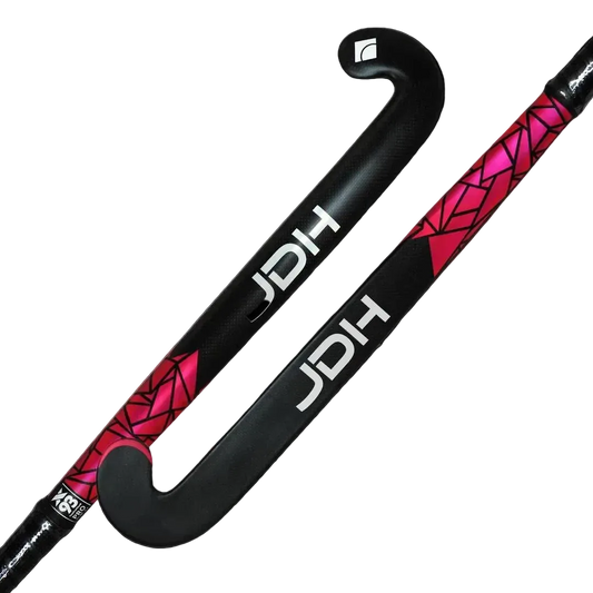 A black JDH field hockey stick with a vibrant pink geometric pattern and white branding, shown against a plain white background.